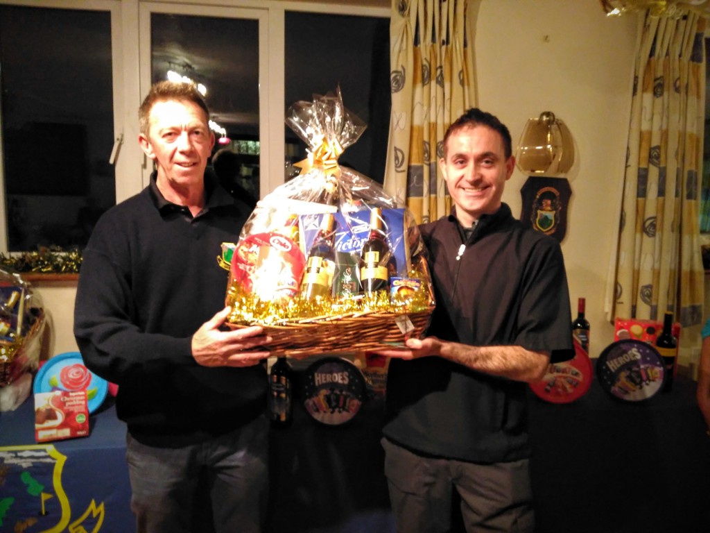 Martin Wynne being presented with the men's 1st prize by Club Captain Ross Andrew at the recent Christmas Bonanza at Boyle Golf Club.