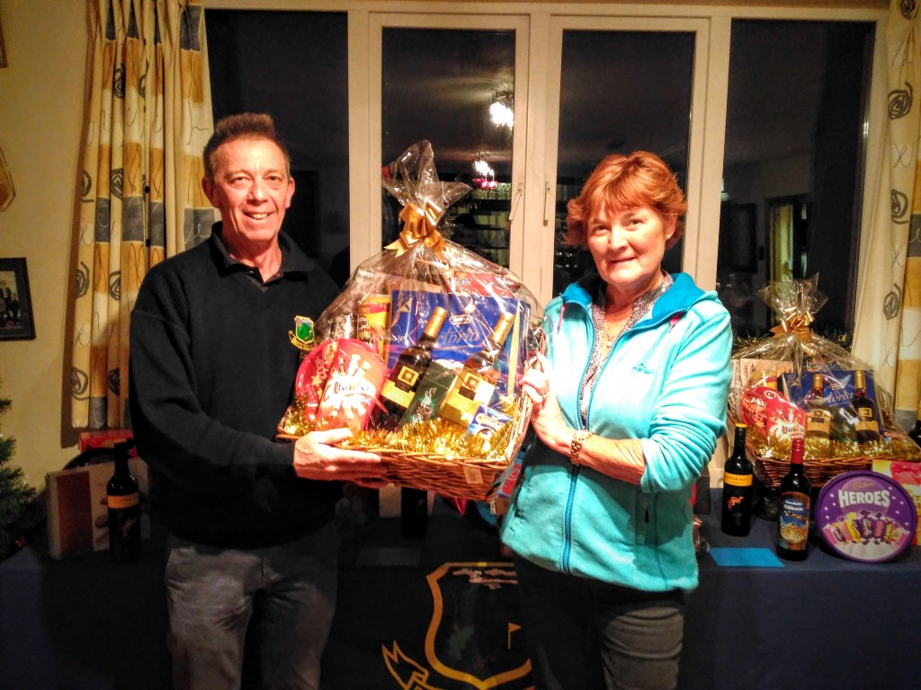 Tish Perry being presented with the ladies 1st prize by Club Captain Ross Andrew at the recent Christmas Bonanza at Boyle Golf Club.